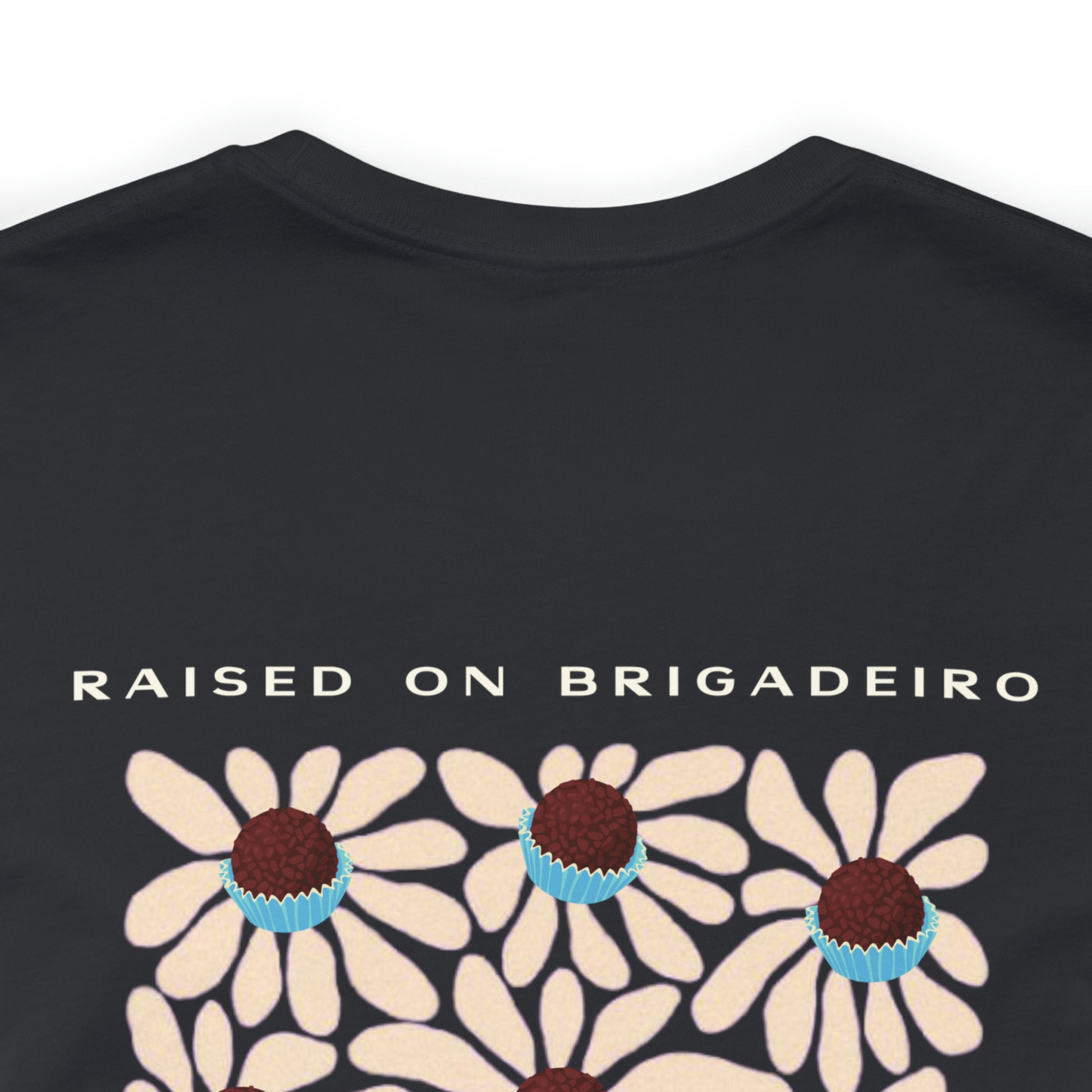 Up close picture of the back of the Raised on Brigadeiro T-shirt in black